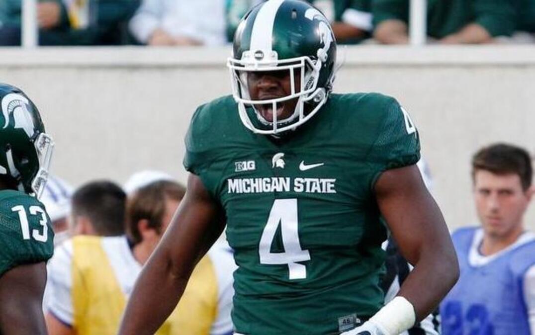 Michigan State's Malik McDowell (4) celebrates a play during a football game Sept. 2, 2016, in East Lansing, Mich. The Seahawks selected McDowell in the NFL draft Friday.