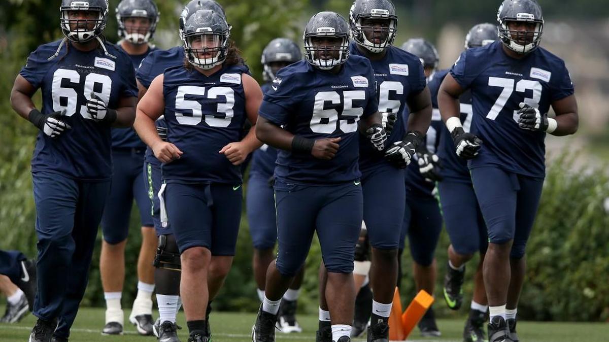 Rookie Joey Hunt (53) will compete in training camp with 2015 starter Patrick Lewis (65) and third-year veteran Justin Britt to be the Seahawks’ new center.