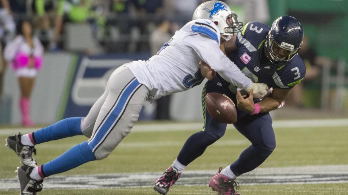 
This is becoming a more common sight by the week: Russell Wilson getting crunched if not chased by unblocked opponents. The winless Lions sacked him six times Monday night, and the quarterback lost two fumbled to free-rushing defenders.

