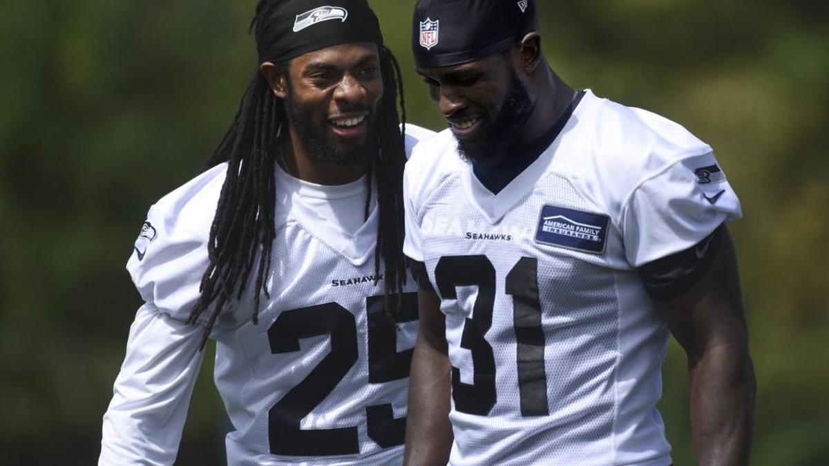 General manager John Schneider inferred Wednesday he wants to get a new contract for veteran strong safety Kam Chancellor (right), who here is joking with teammate Richard Sherman at a Seahawks practice last summer.