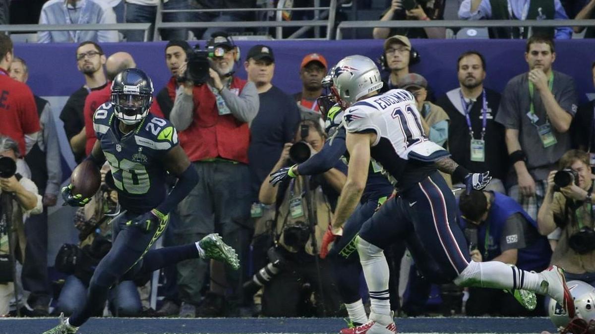 Plays like this interception of New England’s Tom Brady early in Super Bowl 49 are why cornerback Jeremy Lane has big value to the Seahawks. The injuries he got at the end of this play are why he remained affordable to Seattle in free agency.