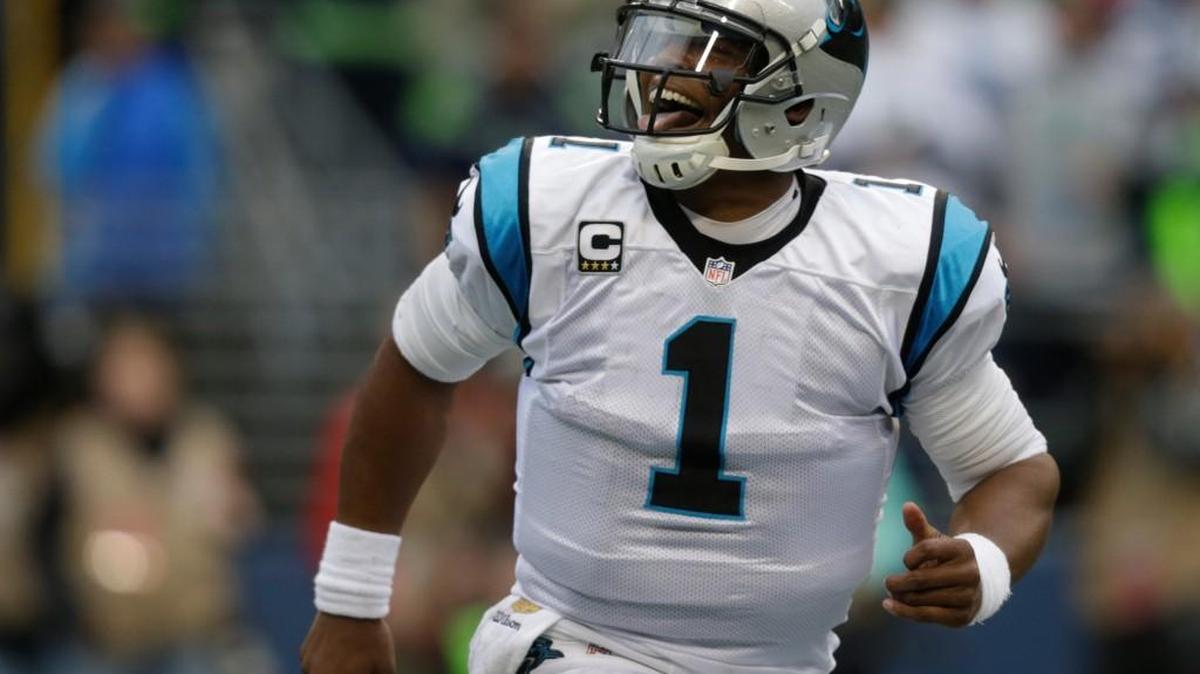 
Carolina Panthers quarterback Cam Newton reacts after he rushed for a touchdown in the first half of an NFL football game against the Seattle Seahawks, Sunday, Oct. 18, 2015, in Seattle.

