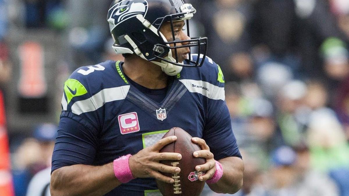 Russell Wilson’s sprained knee and sprained ankle are why he and the Seahawks are not running as much this season -- and partly why the quarterback is ahead of his team-record passing pace from last season.