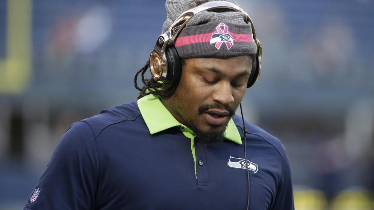 
It won’t even be a beanies and phones for Marshawn Lynch Sunday at Cincinnati. He didn’t even make the Seahawks’ trip to Ohio Friday because of a pulled hamstring.
