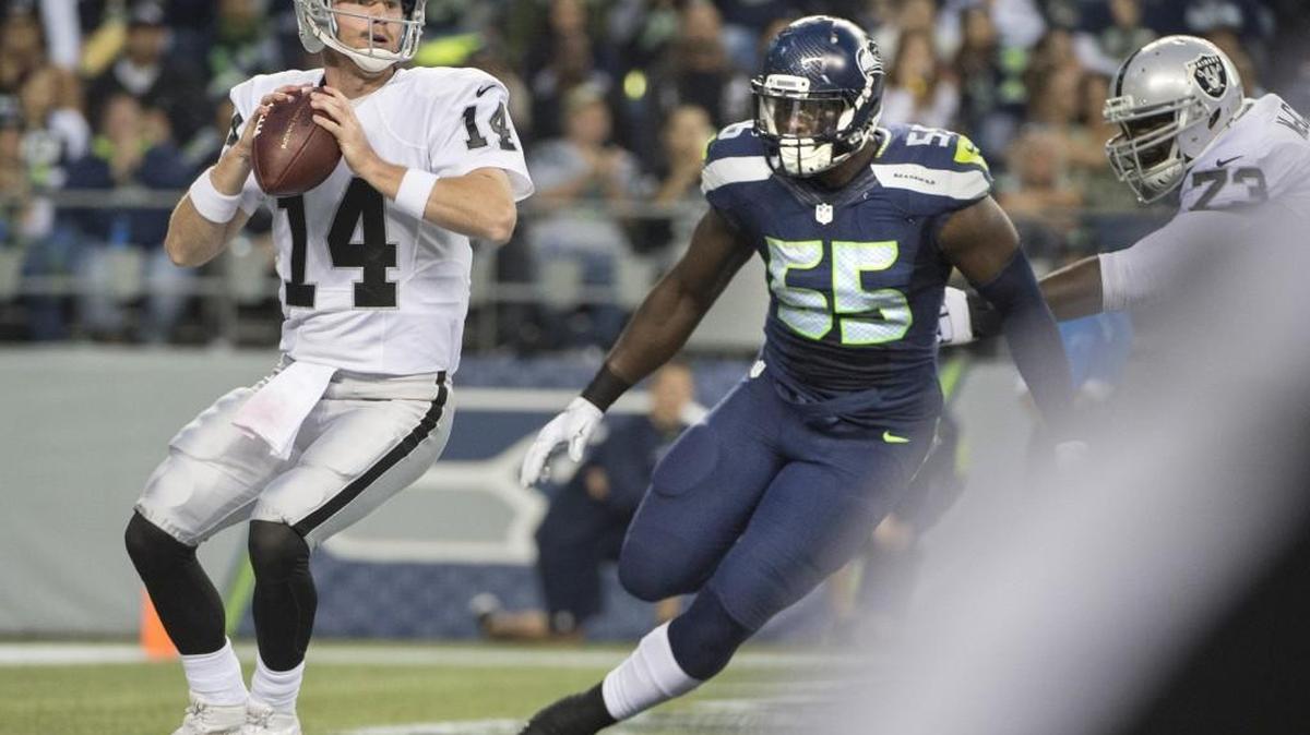 
Seahawks defensive lineman Frank Clark closes in on Raiders quarterback Matt McGloin in the end zone during final preseason game at CenturyLink Field in Seattle on Thursday, Sept. 3, 2015. Clark forced a fumble that was recovered by the Seahawks Jordan Hill for a touchdown.
