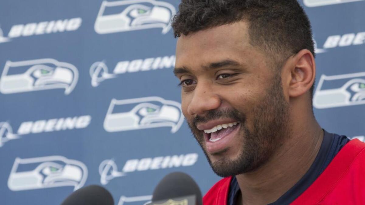 
Seattle Seahawks quarterback Russell Wilson smiles during a news conference on July 31, 2015, in Renton.
