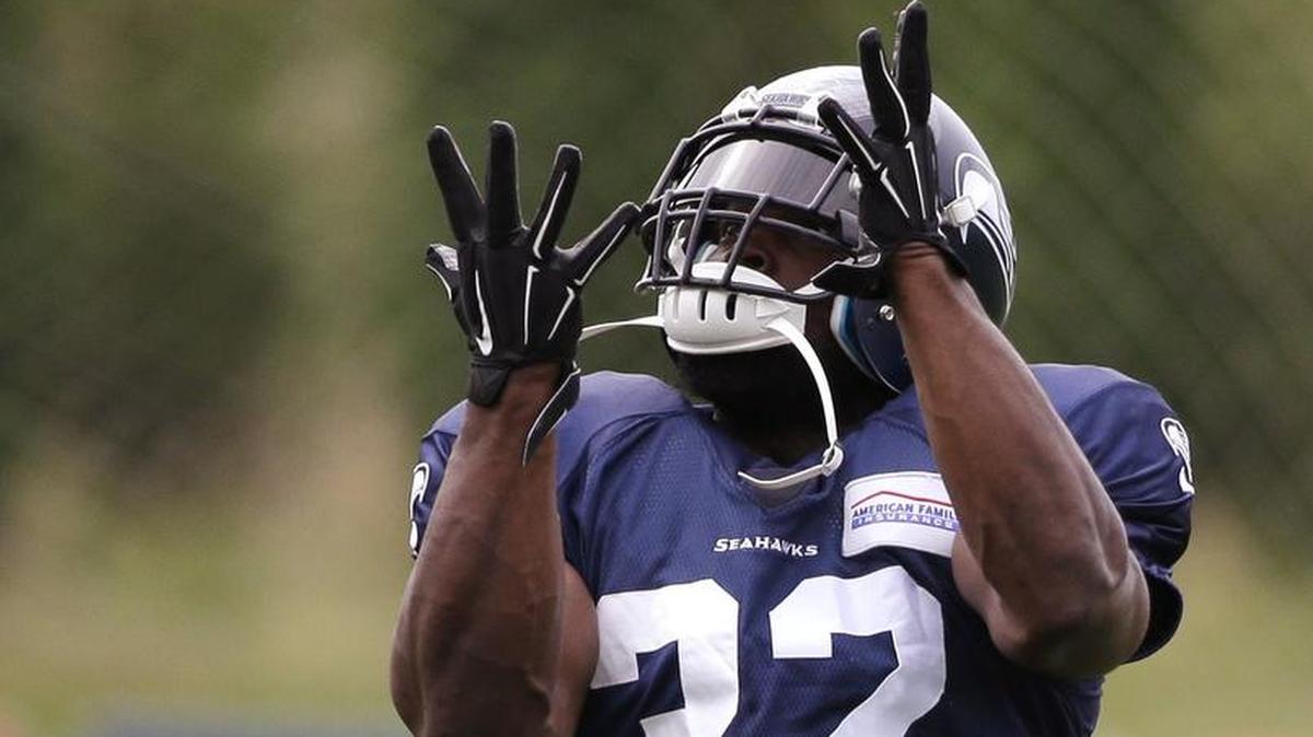 
Robert Turbin, here at Seahawks training camp in a new, No. 32 (he had been 22), is feeling renewed after double-hip surgery at the renowned Steadman Clinic in Vail, Colorado, this offseason. 
