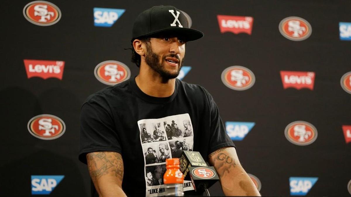 San Francisco 49ers quarterback Colin Kaepernick answers questions at a news conference after an NFL preseason football game against the Green Bay Packers on Friday.