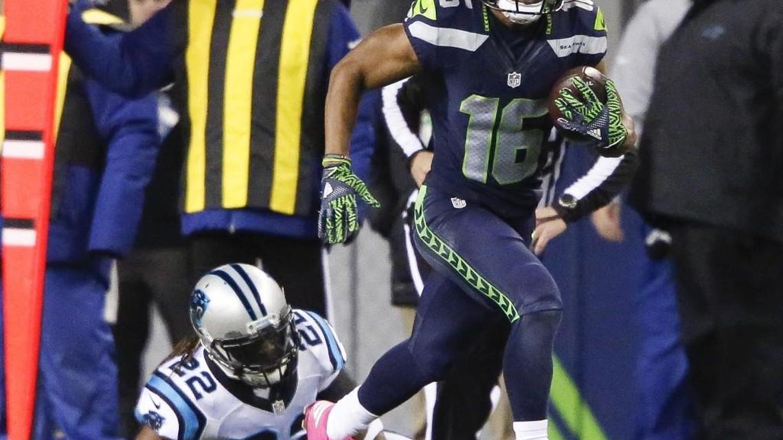 Seahawks wide receiver Tyler Lockett (16) runs down the sideline during a punt return in the first quarter of Sunday’s game against the Carolina Panthers.