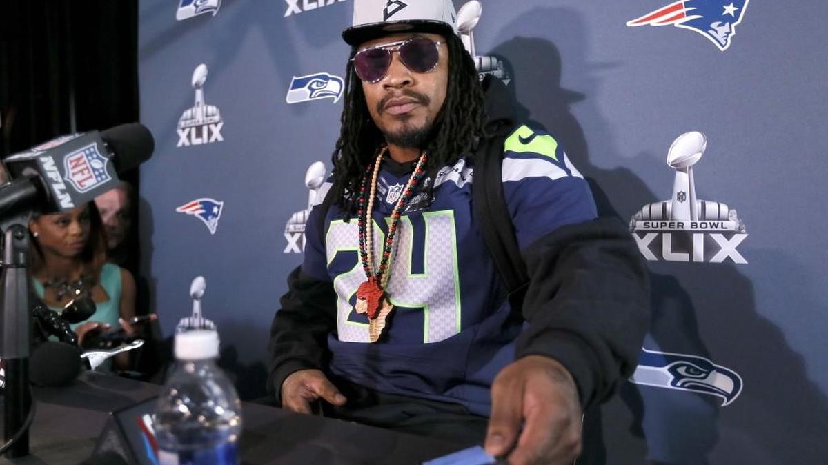 Seattle running back Marshawn Lynch sits for a news conference before Super Bowl 49. Lynch was promised by the Seahawks no one would wear his No. 24 for the first season after his retirement.