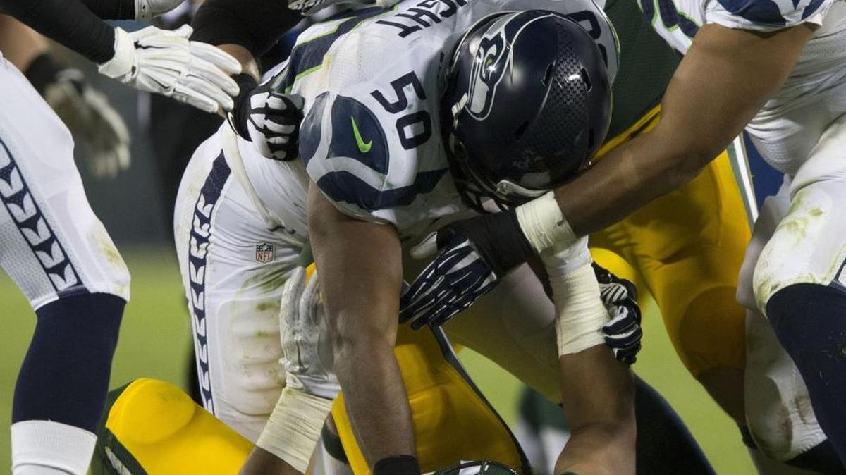 
Seattle Seahawks linebacker K.J. Wright and Green Bay Packers tight end Richard Rodgers tussle during the fourth quarter at Lambeau Field in Green Bay, Wis. Wright ended up being ejected from the game.
