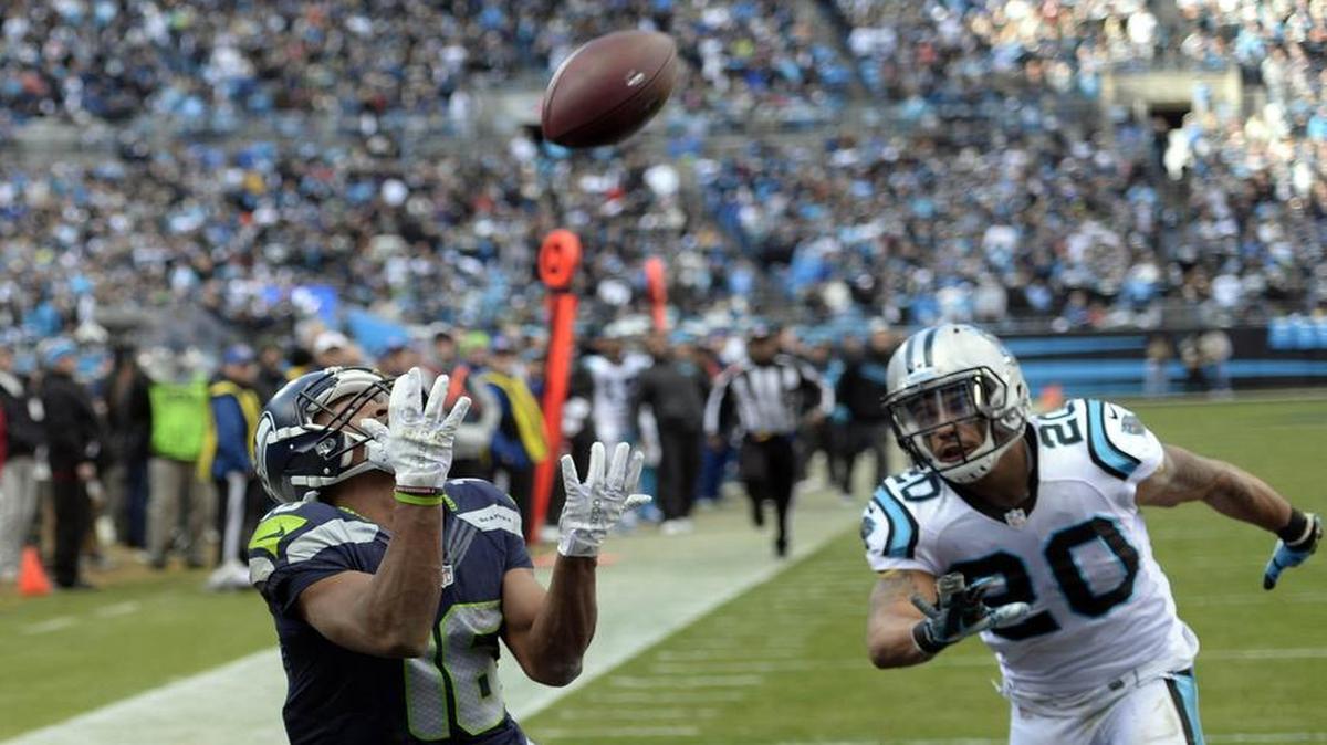 Seattle’s Tyler Lockett, defended by Carolina’s Kurt Coleman, catches a 33-yard touchdown pass from Russell Wilson midway through the third quarter. Lockett finished with three catches for 75 yards, and returned a kickoff for 50 yards.