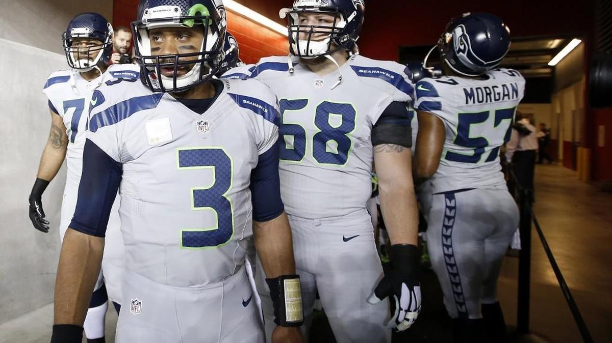 
Seattle Seahawks quarterback Russell Wilson (3) stands with tackle Garry Gilliam, left,, offensive tackle Justin Britt (68) and linebacker Mike Morgan (57) in the Levi's Stadium tunnel before an NFL football game against the San Francisco 49ers in Santa Clara, Calif., Thursday, Nov. 27, 2014.
