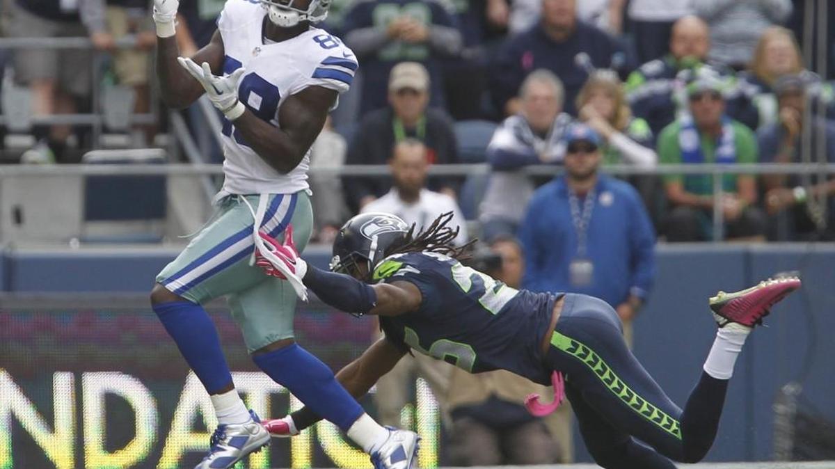 Dallas wide receiver Dez Bryant pulls in a pass over Seattle corner Richard Sherman last season at CenturyLink Field. Sherman held Bryant to just two catches then, and may have to do the same Sunday.