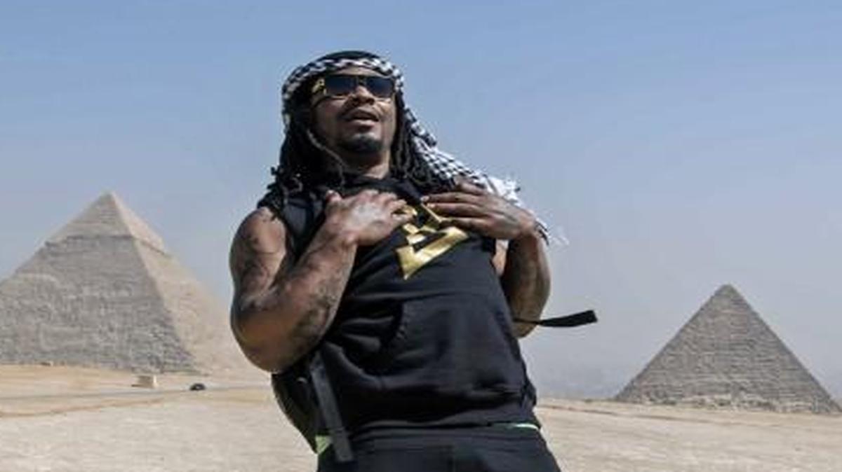 Former Seattle Seahawks running back Marshawn Lynch, left, visits the Pyramids of Giza, in Cairo, Egypt, in February. Lynch retired from the NFL earlier this year.