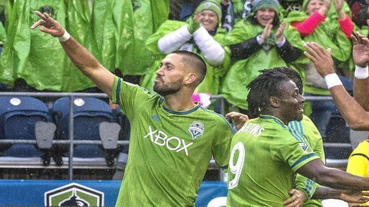 Sounders forward Clint Dempsey, left, acknowledges the crowd Sunday after scoring his second goal against Real Salt Lake in a 3-1 win for Seattle at CenturyLink Field. The Sounders will play host to the Los Angeles Galaxy in a playoff elimination game later this week.
