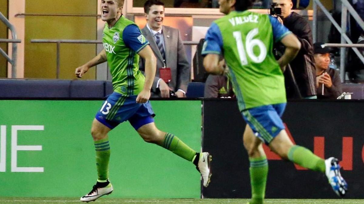 Seattle’s Jordan Morris, left, celebrates with teammate Nelson Valdez, right, after Morris scored his first MLS goal Saturday against Philadelphia during the Sounders’ 2-1 victory.