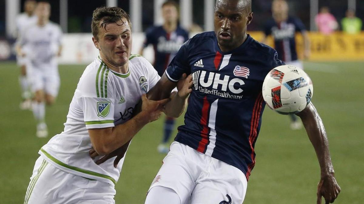 Seattle Sounders's Jordan Morris, left, and New England Revolution's Jose Goncalves battle for the ball during the second half of an MLS soccer game Saturday, May 28, 2016, in Foxborough, Mass. The Revolution won 2-1.