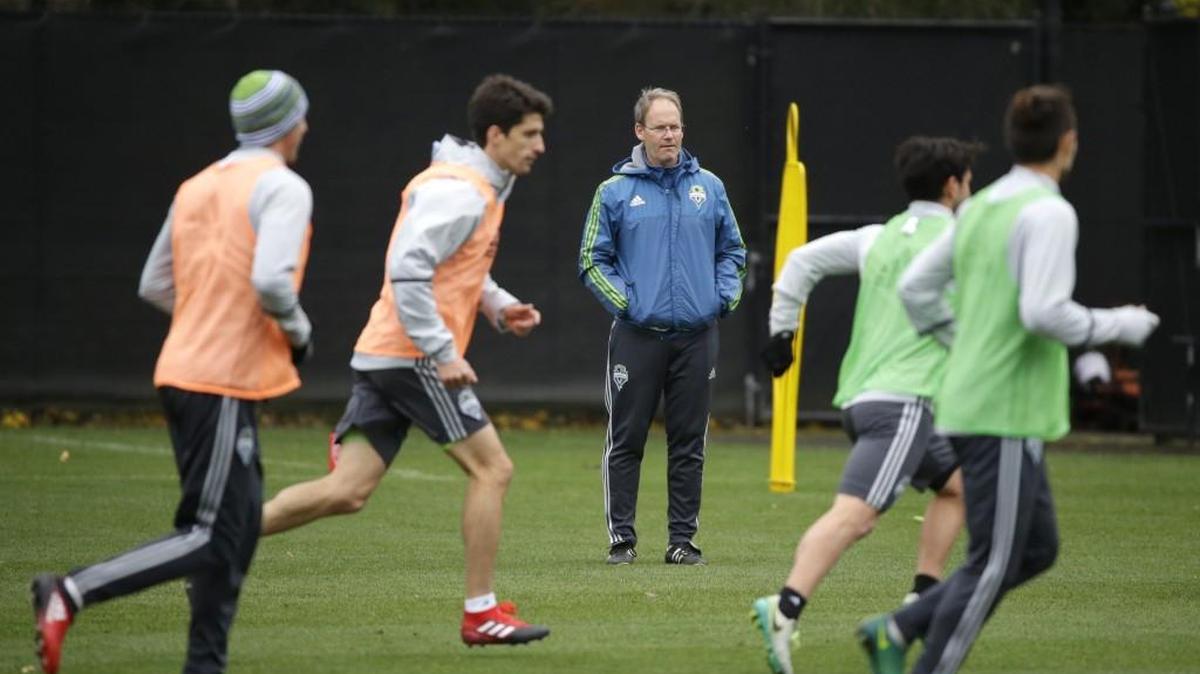 Seattle Sounders coach Brian Schmetzer, center, watches players during a practice drill in Tukwila. Schmetzer’s journey with the Sounders started when he was signed by the NASL Sounders in 1980 as a 17-year-old player from Lake City.