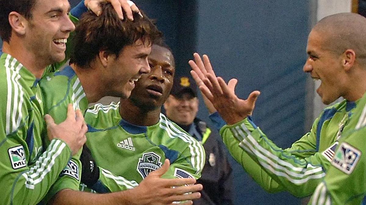 Zach Scott, left, Brad Evans, second from left, and Ossie Alonso, right, are hoping their final run as a trio ends with the Sounders’ first MLS Cup title. Seattle will play at Toronto on Saturday, Dec. 10, for the league championship.