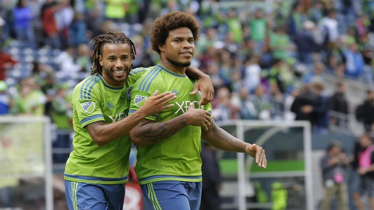 
Sounders central defender Roman Torres, right, celebrates with Tyrone Mears after they beat the Portland Timbers last month. Torres tore his anterior cruciate ligament Saturday against San Jose and will miss betwee six and nine months.
