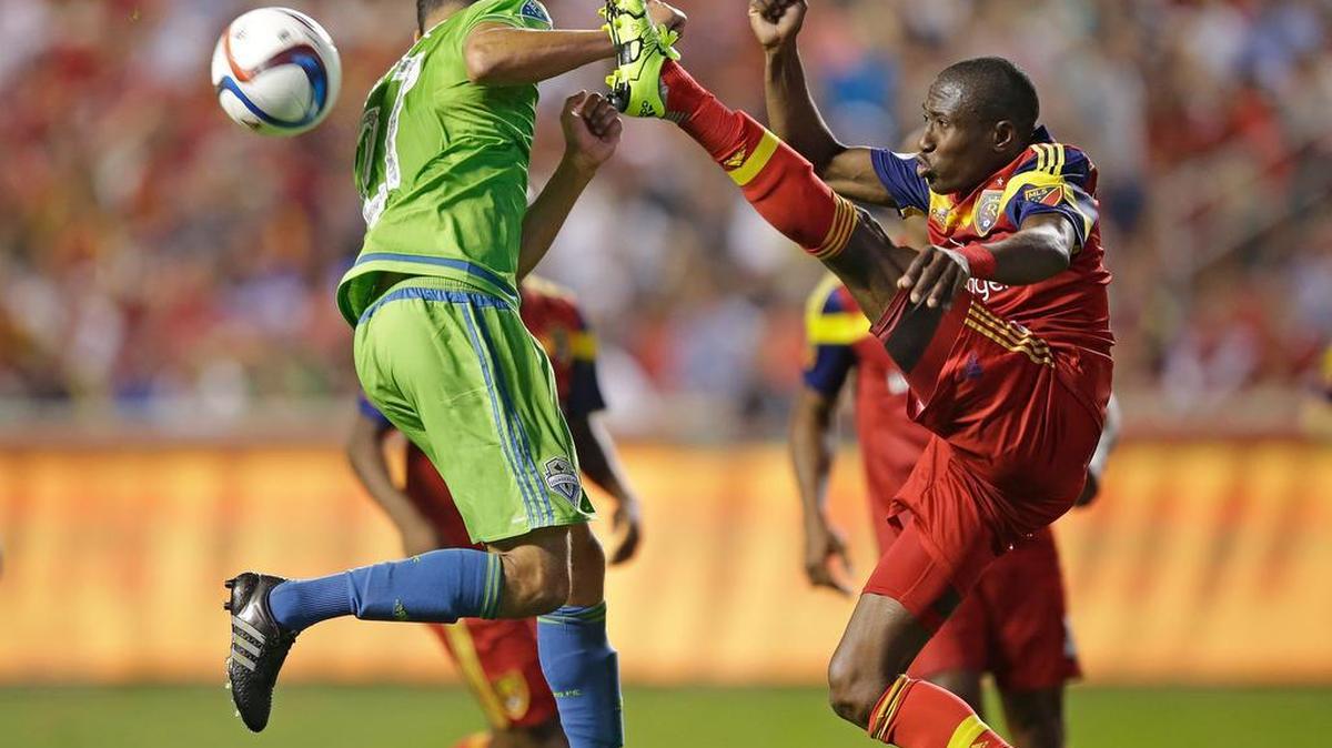 
Real Salt Lake's Demar Phillips, right, clears the ball as Seattle Sounders' Lamar Neagle of Federal Way defends during the second half of an MLS soccer match Saturday in Sandy, Utah. Real Salt Lake won, 2-0.
