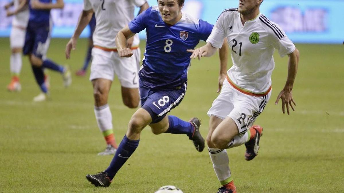 U.S. defender Jordan Morris (8) chases the ball down against Mexico defender Hiram Mier during an exhibition match on April 15 in San Antonio. Morris, a Mercer Island native, may possibly land in Seattle with the Sounders.