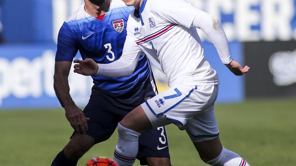 Iceland midfielder Aron Sigurdarson, right, and United States defender Brad Evans fight for the ball Sunday in the first half of a men's international friendly soccer game in Carson, California.