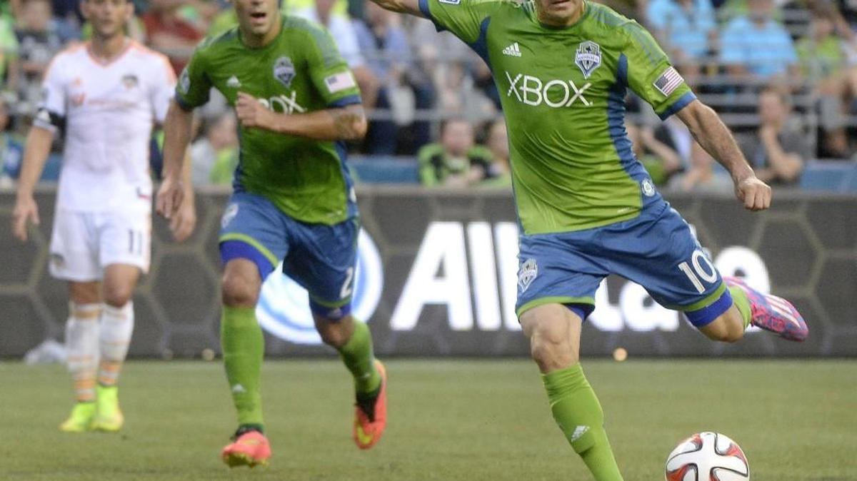 Now-former Sounders midfielder take Marco Pappa takes a shot against the Houston Dynamo at CenturyLink Field in 2014 match.