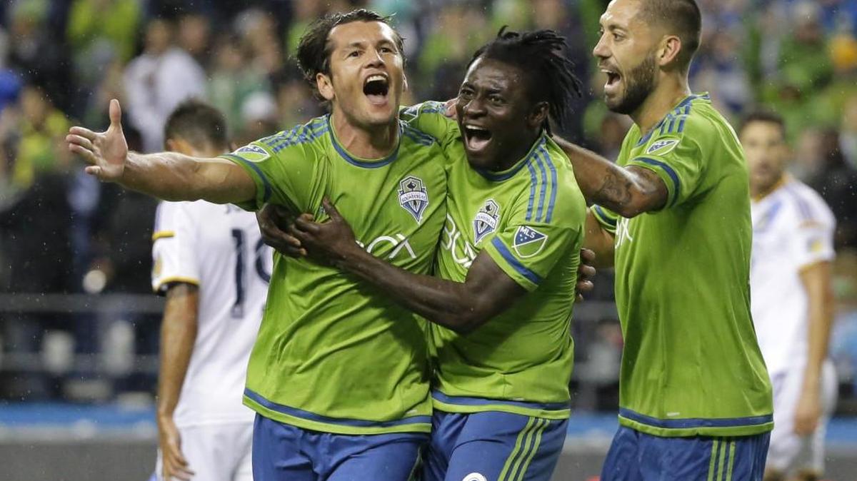 Seattle Sounders forward DPs Nelson Valdez, left, Obafemi Martins, center, and Clint Dempsey, shown celebrating Valdez goal in 2015 MLS playoffs.