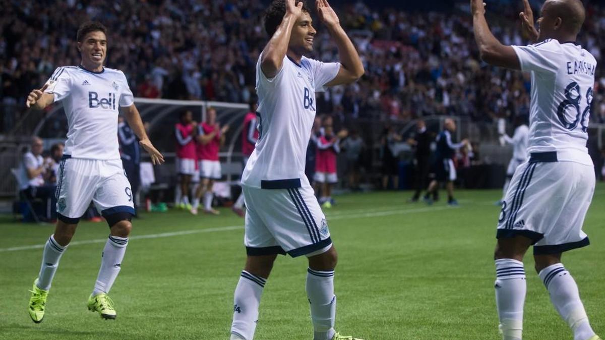 
Vancouver Whitecaps' Nicolas Mezquida, Kianz Froese and Robert Earnshaw, from left, celebrate Froese's goal against C.D. Olimpia during the first half of their CONCACAF Champions League win last night at BC Place. 
