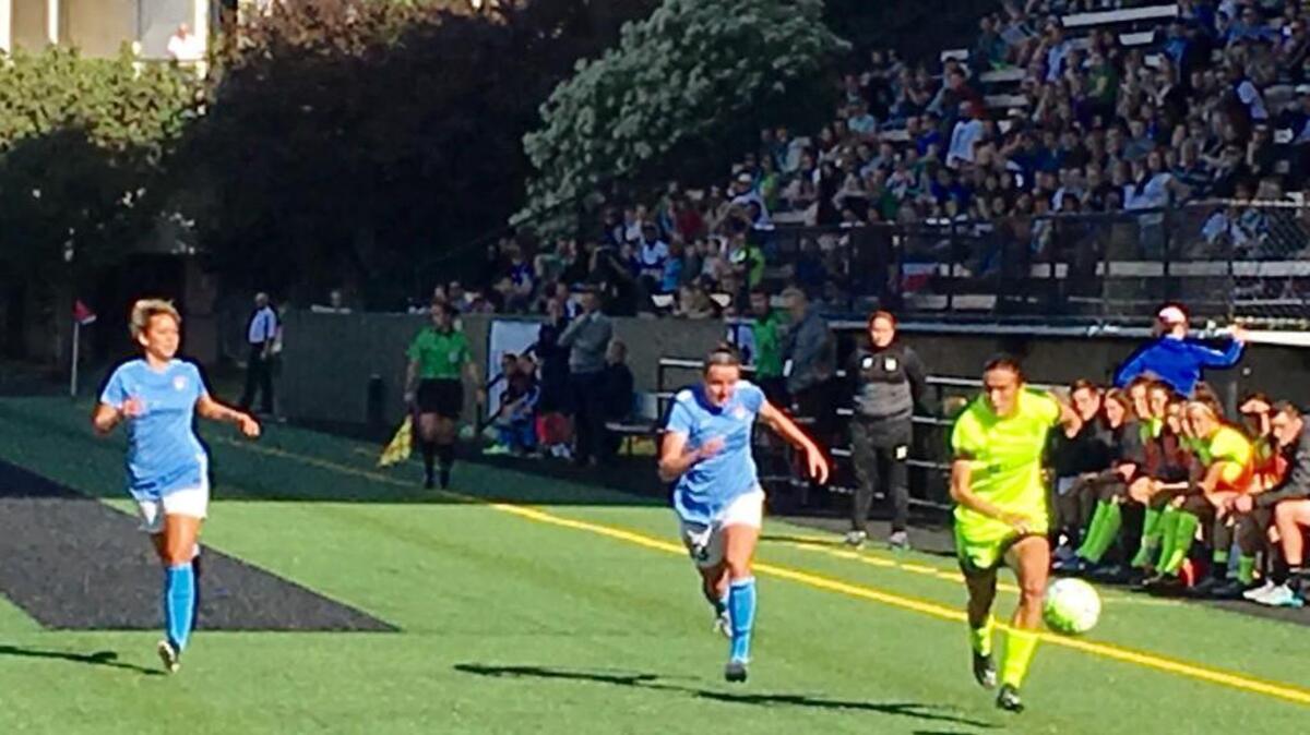 Seattle Reign rookie defender Carson Pickett pushes forward onto the attack in season opener against Sky Blue FC at Memoiral Stadium.
