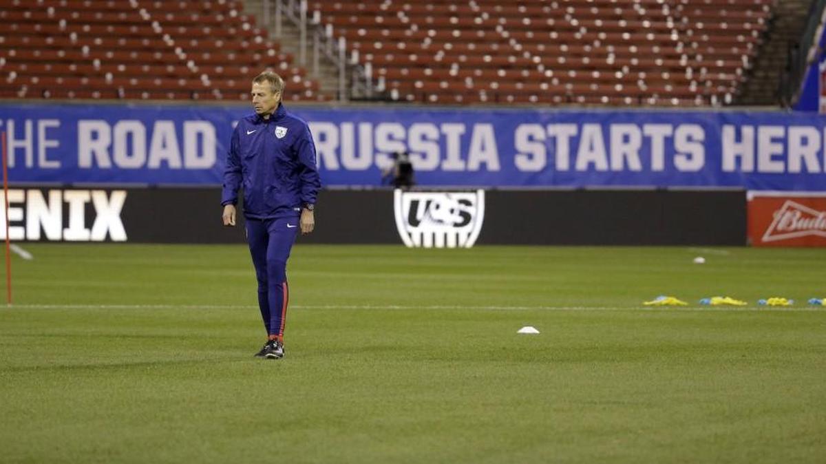 United States men's national soccer team coach Jurgen Klinsmann watches his team warm up during practice Thursday in St. Louis. The U.S. team is scheduled to play a World Cup qualifying match against St. Vincent and the Grenadines on Friday.