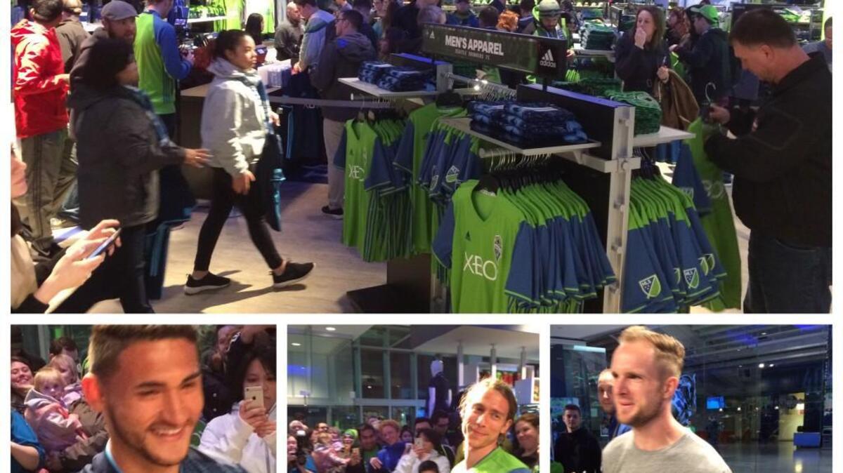 Fans swarm CenturyLink Pro Shop for new Sounders merchandise, some of which was modeled by players (from botton left) Cristian Roldan, Andy Craven and Stefan Frei.