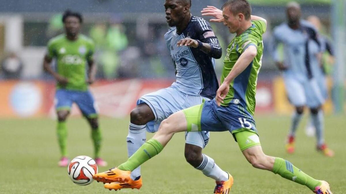 Sporting Kansas City, shown here in a 2014 match in Seattle, will return March 6 for the Sounders’ 2016 MLS season opener.
