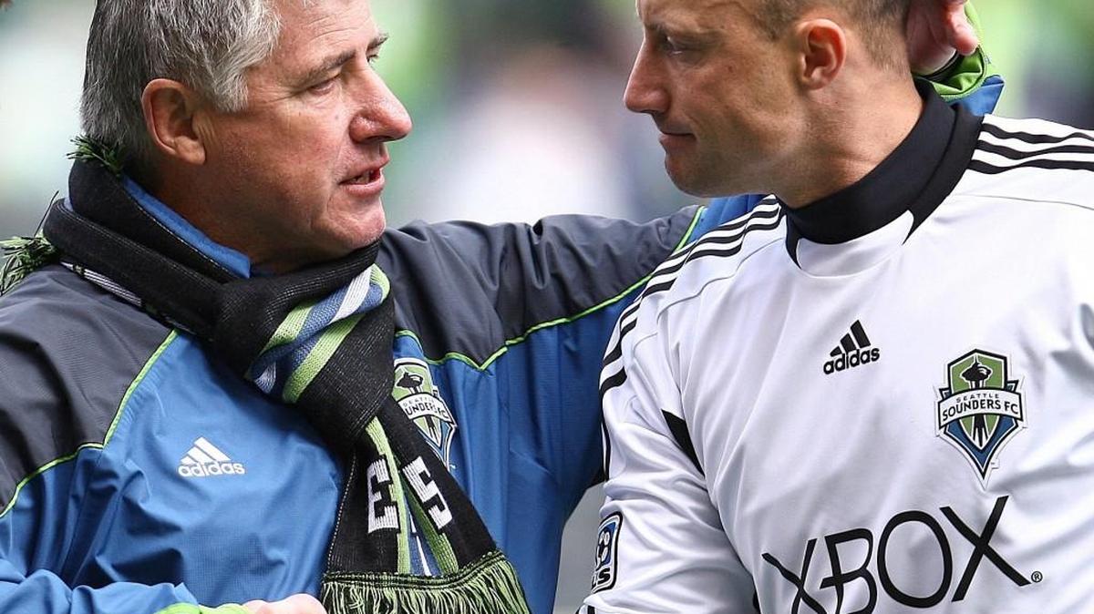 
Seattle Sounders head coach Sigi Schmid with goalkeeper Kasey Keller after match in 2011.
