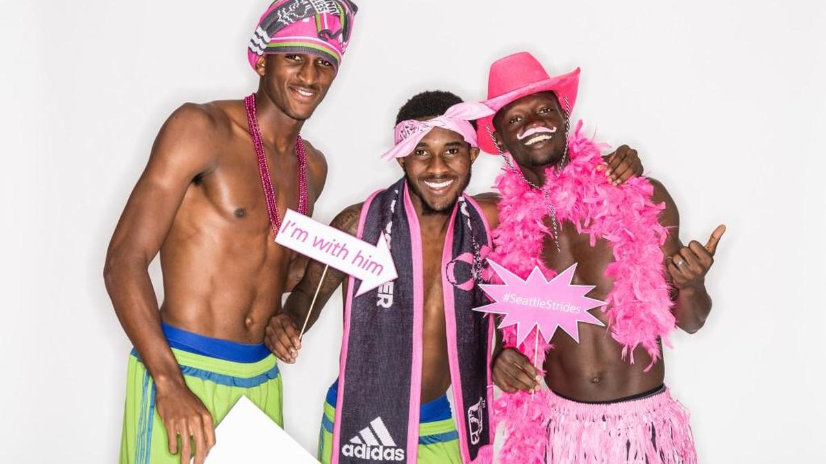
Sounders Damion Lowe, Oniel Fisher and Michael Azira pose for club’s breast cancer awareness efforts.
