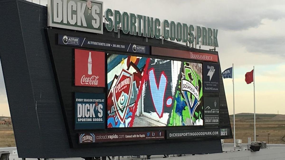 Scoreboard sets the scene: Sounders at Rapids under threatening Colorado sky.