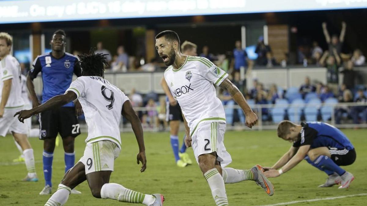
Seattle Sounders forward Obafemi Martins (9) is congratulated by Clint Dempsey (2) after scoring the tying goal against the Earthquakes in their MLS soccer match Saturday at San jose.
