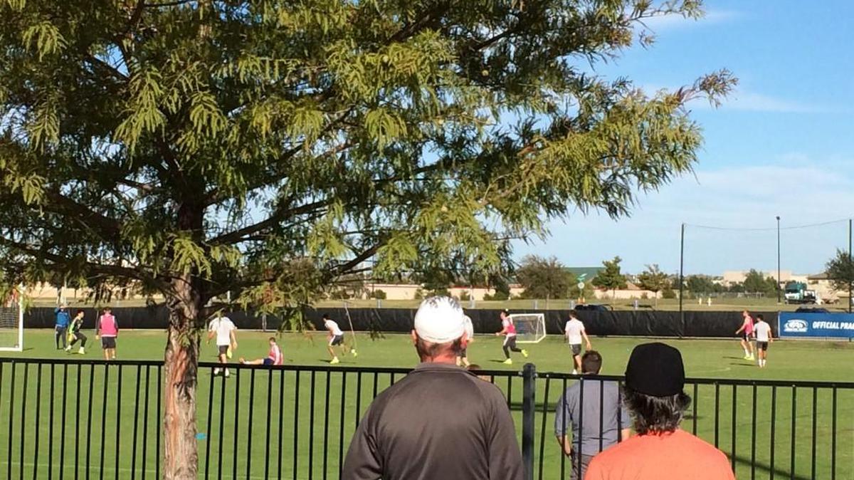 Parents and fans from the surrounding recreational fields watch the Seattle Sounders go through Saturday training at the FC Dallas facility in Frisco, Texas.