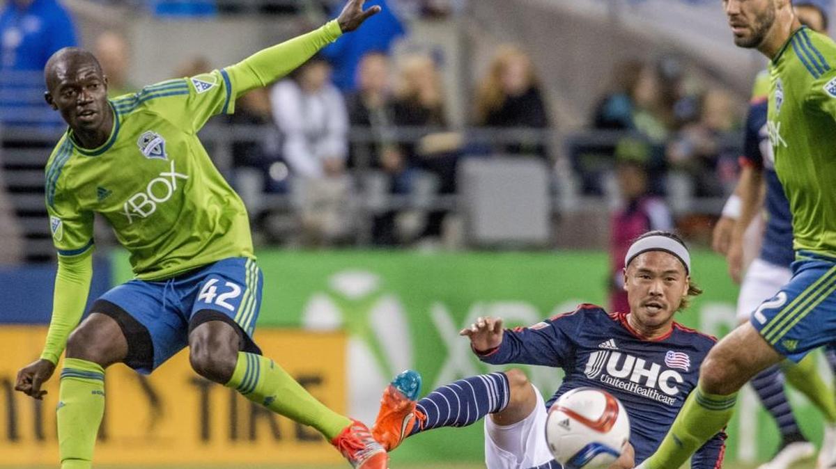 Sounders midfielder Micheal Azira (left) shown in action against the New England Revolution last season at CenturyLink Field.