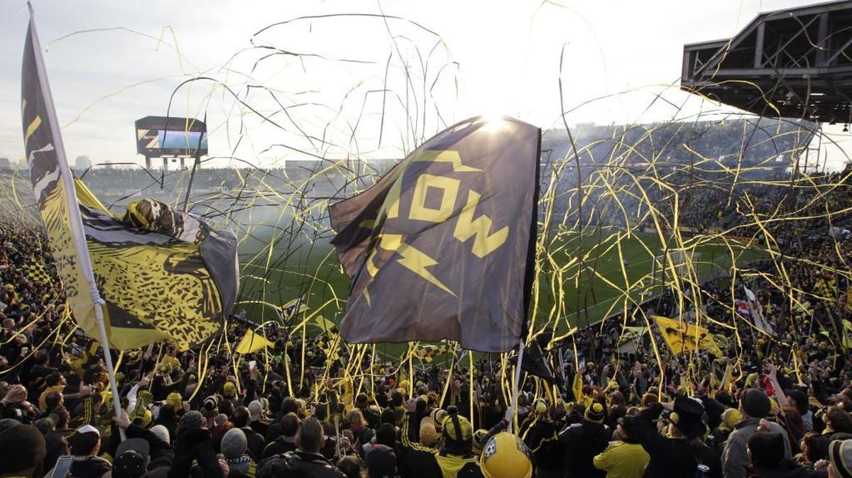 Fans cheer during the start of the MLS Cup championship soccer game between the Columbus Crew and the Portland Timbers, Sunday in Columbus, Ohio.