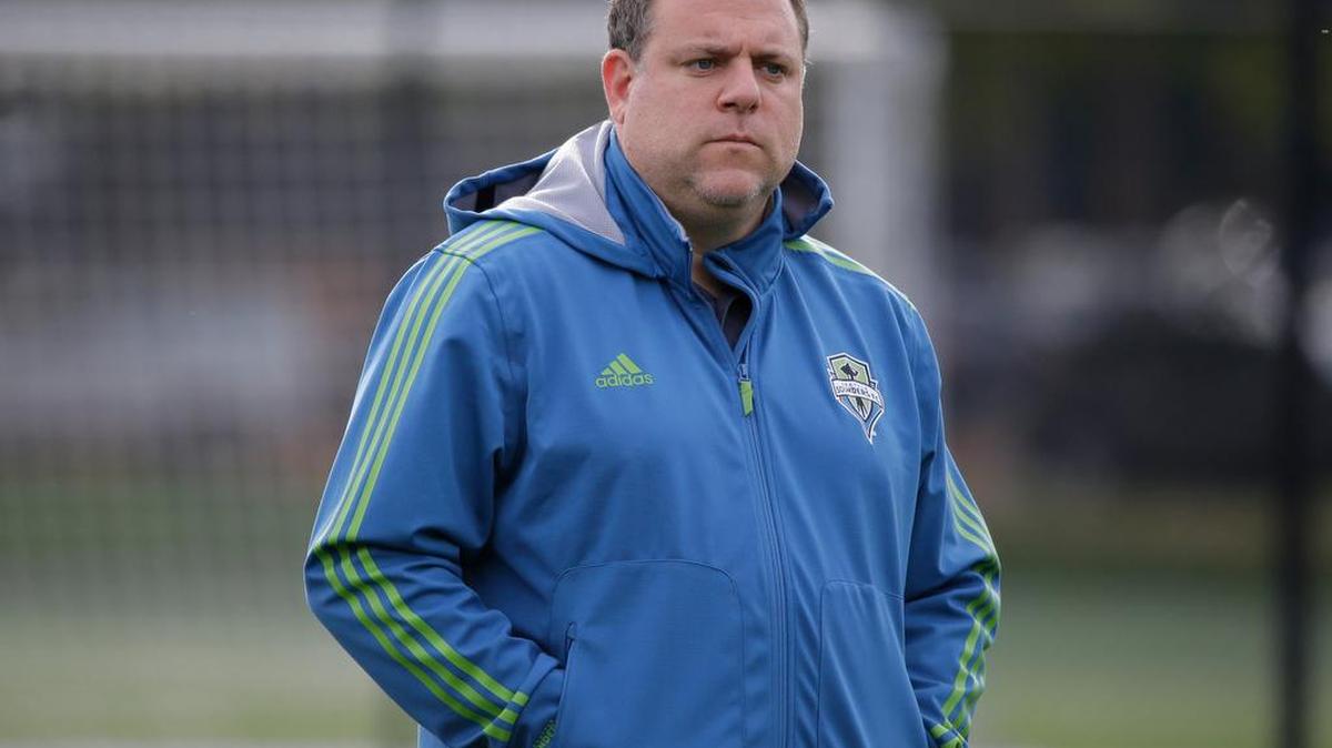 Seattle Sounders general manager Garth Lagerwey watches an MLS soccer training session last month in Tukwila.