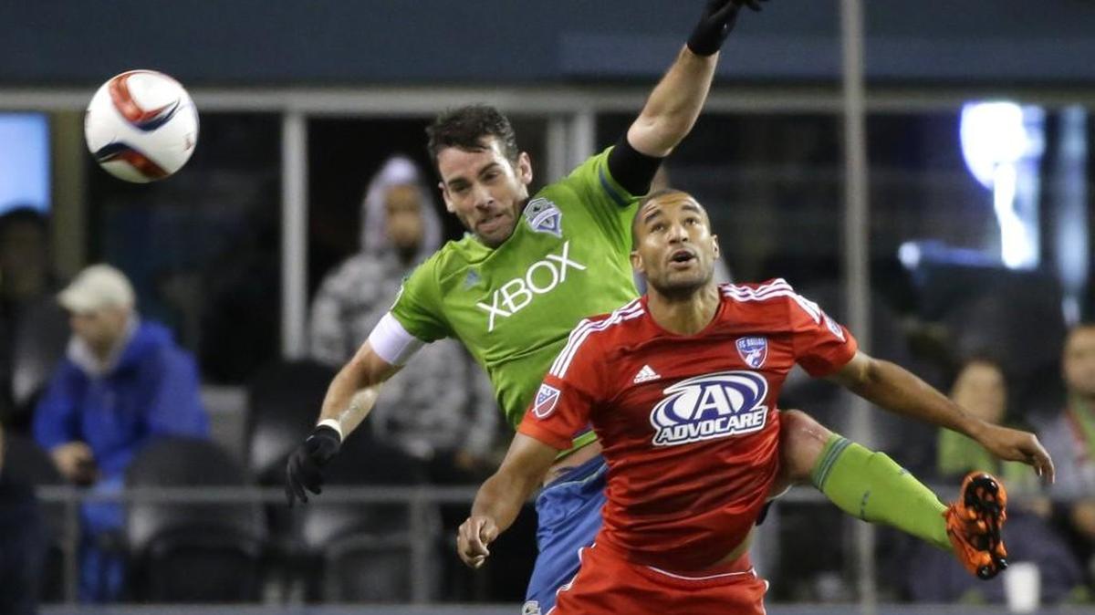 Seattle Sounders' Zach Scott, left, in the second half of an MLS soccer Western Conference semifinal home match against Dallas last month.