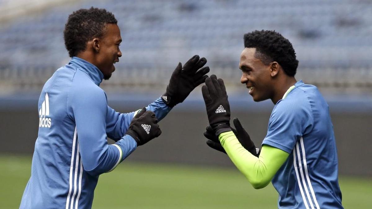 Seattle Sounders' Myron Samuel, left, and Oalex Anderson after a preseason training session in Seattle.