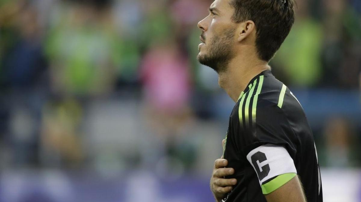 Seattle Sounders defender and captain Brad Evans stands during the national anthem before an MLS match against the Los Angeles Galaxy in Seattle.