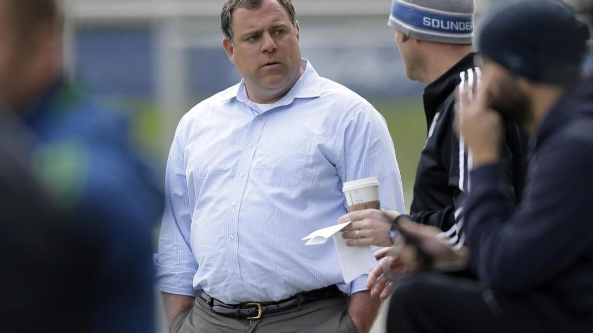 Seattle Sounders general manager Garth Lagerwey, center, observes MLS soccer training at Starfire Sports Complex in Tukwila
