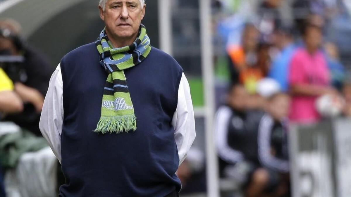 
Seattle Sounders head coach Sigi Schmid stands on the sideline during MLS match with the Portland Timbers.

