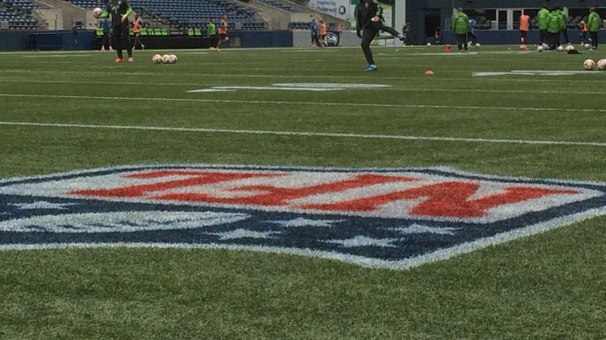 
Sounders shown practicing on CenturyLink Field pitch with NFL lines before 2014 playoff game.
