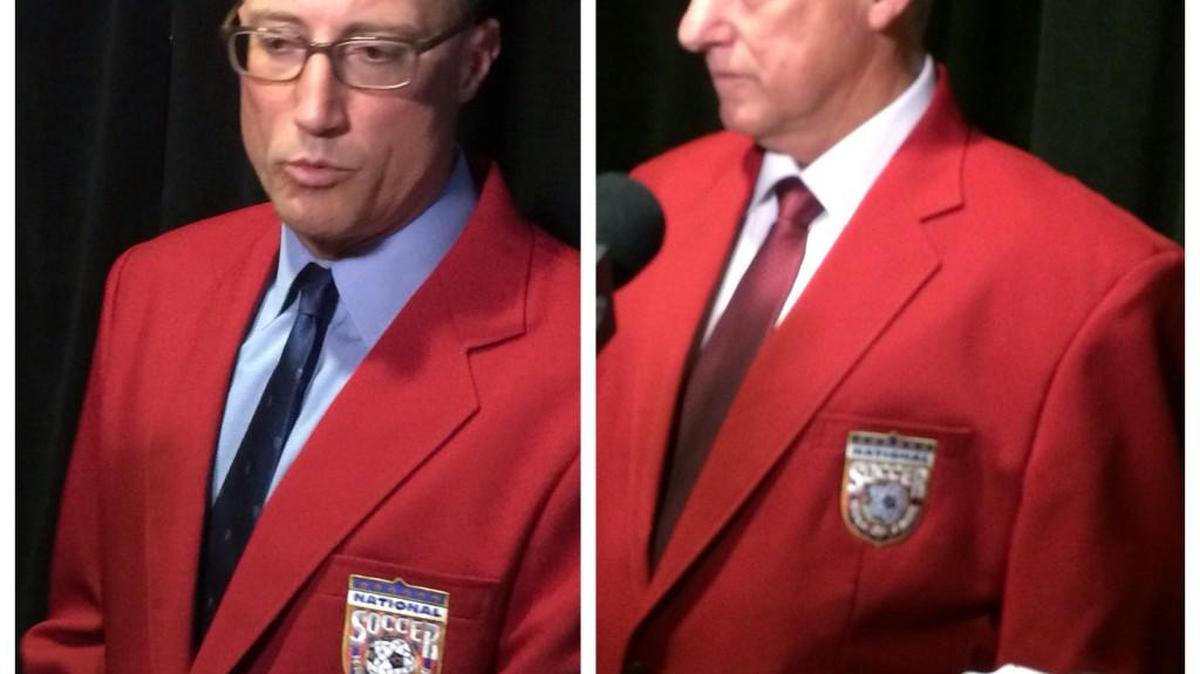 
Kasey Keller, left, and Sigi Schmid in their new red National Soccer Hall of Fame coats after their inductions Saturday at the Museum of History and Industry in Seattle.
